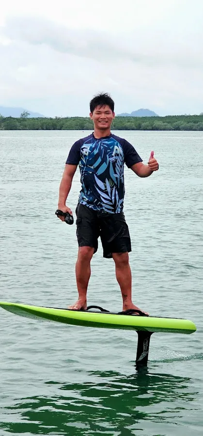 Custom sublimated rashguard worn during an efoil session on open water